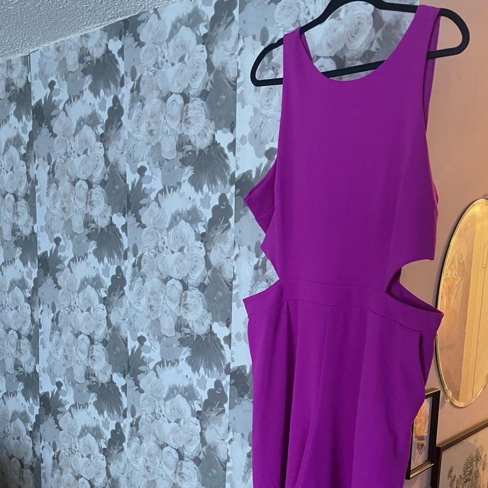 Long jumpsuit with side cutouts and pockets